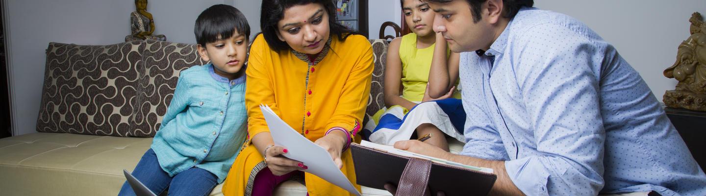 Family looking at papers